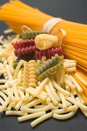 simsearch:659-01864831,k - A bundle of spaghetti and various types of coloured pasta Stock Photo - Premium Royalty-Free, Code: 659-01864804