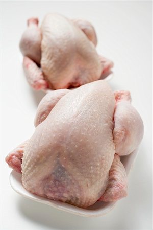 poultry - Two fresh chickens on polystyrene trays Stock Photo - Premium Royalty-Free, Code: 659-01864943