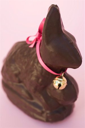 Chocolate Easter Bunny with pink bow and small bell Stock Photo - Premium Royalty-Free, Code: 659-01865009