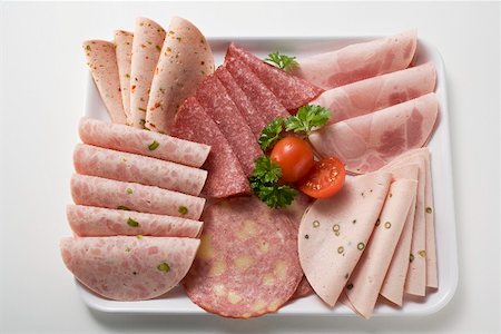 simsearch:659-02211870,k - Cold cuts platter with cherry tomatoes & parsley (overhead) Stock Photo - Premium Royalty-Free, Code: 659-01865075