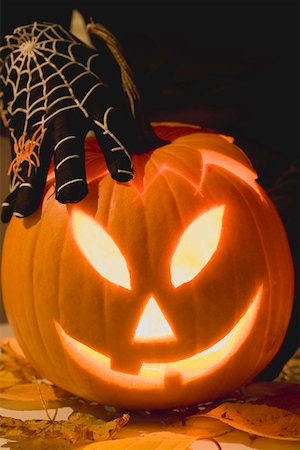 simsearch:659-01864379,k - Hand in cobweb glove holding pumpkin lantern Stock Photo - Premium Royalty-Free, Code: 659-01865164