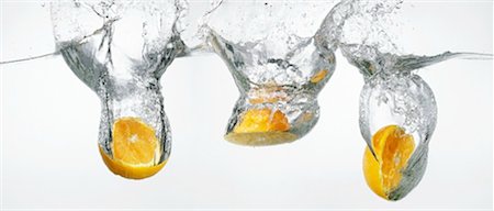 Oranges falling into water Stock Photo - Premium Royalty-Free, Code: 659-01865316