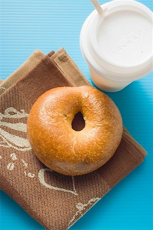 Bagel and cup of coffee (overhead view) Stock Photo - Premium Royalty-Free, Code: 659-01865380