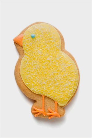 simsearch:659-01865462,k - Easter biscuit (yellow chick) Foto de stock - Royalty Free Premium, Número: 659-01865448