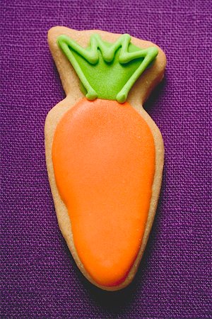 easter cookie - Easter biscuit (carrot) on purple linen Stock Photo - Premium Royalty-Free, Code: 659-01865459