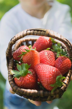 simsearch:659-01864546,k - Person holding basket of fresh strawberries Stock Photo - Premium Royalty-Free, Code: 659-01865664