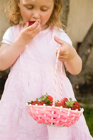 simsearch:659-03529776,k - Small girl eating strawberries Stock Photo - Premium Royalty-Free, Code: 659-01865662