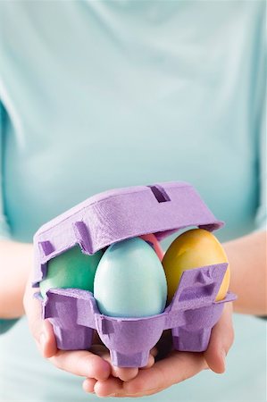 Woman holding egg box full of coloured Easter eggs Stock Photo - Premium Royalty-Free, Code: 659-01865779