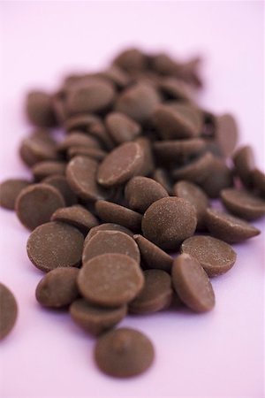 A heap of chocolate buttons Foto de stock - Sin royalties Premium, Código: 659-01865816