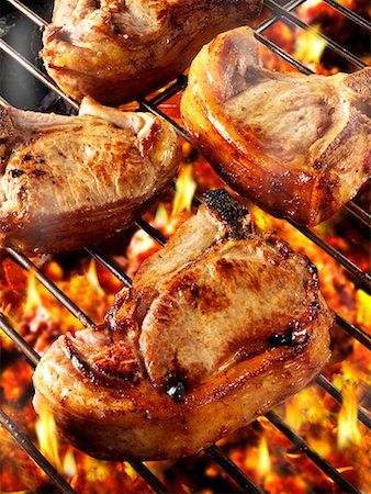 Pork chops on barbecue rack Stock Photo - Premium Royalty-Free, Code: 659-01866064