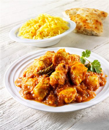Chicken curry, rice and flatbread (India) Stock Photo - Premium Royalty-Free, Code: 659-01866119