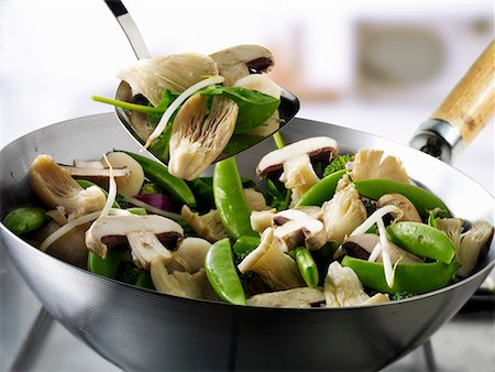 snow pea, - Vegetables and mushrooms in wok and on spatula Stock Photo - Premium Royalty-Free, Code: 659-01866128