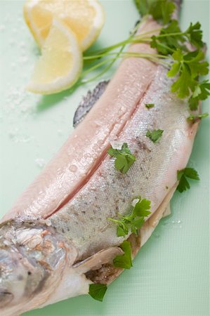 Trout with parsley, lemon wedges and salt Stock Photo - Premium Royalty-Free, Code: 659-01866362