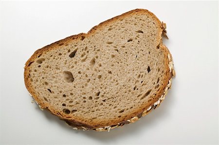 simsearch:659-01866634,k - Slice of oat bread Foto de stock - Sin royalties Premium, Código: 659-01866658