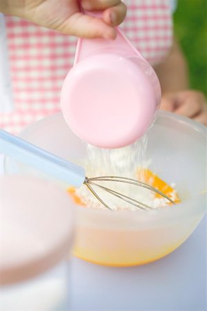 simsearch:659-01849333,k - Child adding flour to egg yolks Stock Photo - Premium Royalty-Free, Code: 659-01866695
