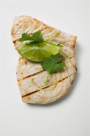 steak grilled from above - Grilled swordfish steak with lime and coriander leaves Stock Photo - Premium Royalty-Free, Code: 659-01866874