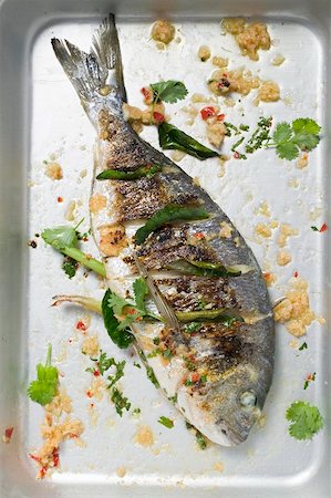 roasted fish - Roasted gilthead bream with lemon grass & coriander leaves Stock Photo - Premium Royalty-Free, Code: 659-01866876