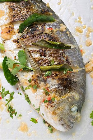 roasted fish - Roasted gilthead bream with lemon leaves Stock Photo - Premium Royalty-Free, Code: 659-01866877