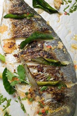 roasted fish - Roasted gilthead bream with lemon leaves Stock Photo - Premium Royalty-Free, Code: 659-01866878