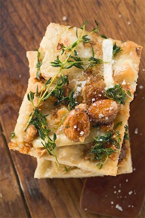 flat bread - Focaccia with goat's cheese and almonds Stock Photo - Premium Royalty-Free, Code: 659-01867055