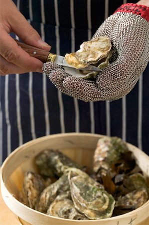 Shucking oysters Stock Photo - Premium Royalty-Free, Code: 659-01867107