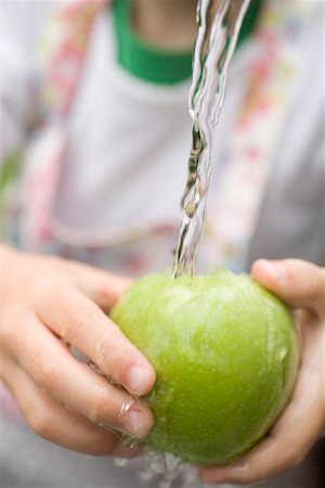 simsearch:659-01867277,k - Child holding green apple under running water Stock Photo - Premium Royalty-Free, Code: 659-01867262