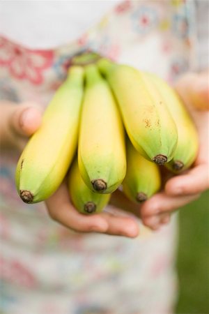 simsearch:659-01864546,k - Child's hands holding bunch of bananas Stock Photo - Premium Royalty-Free, Code: 659-01867270