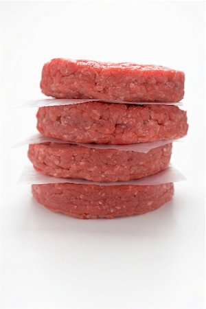 simsearch:659-01846050,k - Raw burgers, in a pile Stock Photo - Premium Royalty-Free, Code: 659-01867444