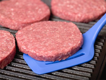 simsearch:659-01846050,k - Raw burgers on electric grill Stock Photo - Premium Royalty-Free, Code: 659-01867565