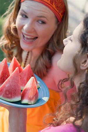 simsearch:659-02212589,k - Two young women with wedges of watermelon Stock Photo - Premium Royalty-Free, Code: 659-01867608