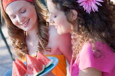 simsearch:659-02212589,k - Two young women with wedges of watermelon Stock Photo - Premium Royalty-Free, Code: 659-01867610