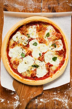 pizza above - Mozzarella pizza on server Stock Photo - Premium Royalty-Free, Code: 659-01860022