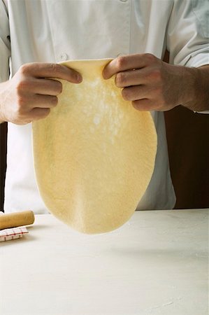 form hand - Shaping pizza dough by hand (stretching) Stock Photo - Premium Royalty-Free, Code: 659-01860044