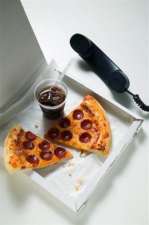 pizza box nobody - Slices of American-style pepperoni pizza with cola Stock Photo - Premium Royalty-Free, Code: 659-01860319