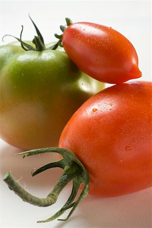 Three different tomatoes Stock Photo - Premium Royalty-Free, Code: 659-01860448