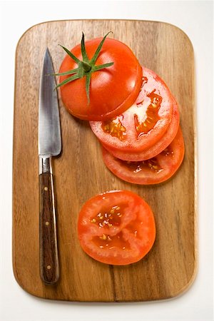 simsearch:659-01843156,k - Tomato slices and knife on chopping board (overhead view) Stock Photo - Premium Royalty-Free, Code: 659-01860484