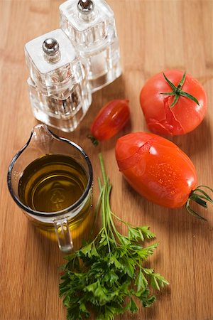 simsearch:659-06307662,k - Tomato sauce ingredients: tomatoes, parsley, olive oil, salt Stock Photo - Premium Royalty-Free, Code: 659-01860513