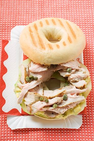 Bagel filled with pork fillet, capers & honey mustard relish Stock Photo - Premium Royalty-Free, Code: 659-01860858