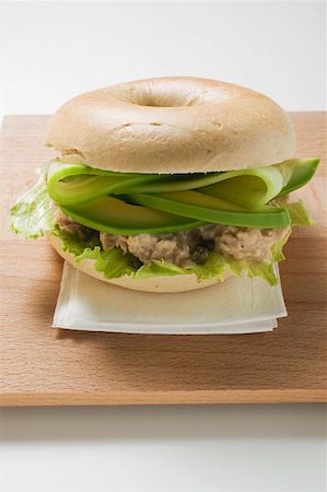 sandwich with avocado - Bagel filled with avocado, tuna salad and capers Stock Photo - Premium Royalty-Free, Code: 659-01860909