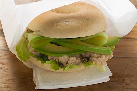 sandwich with avocado - Bagel filled with avocado, tuna salad and capers Stock Photo - Premium Royalty-Free, Code: 659-01860912