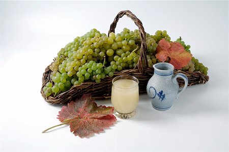 simsearch:659-01861229,k - Green grapes in basket, grape must and leaves Stock Photo - Premium Royalty-Free, Code: 659-01861268