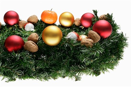 Christmas arrangement of fir sprigs, baubles and nuts Stock Photo - Premium Royalty-Free, Code: 659-01861394