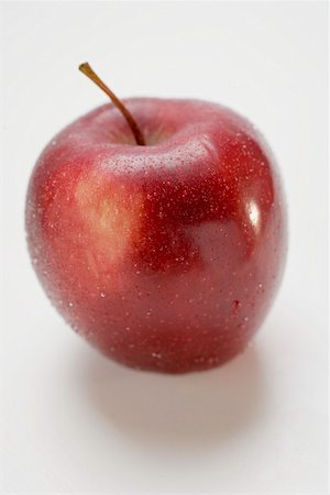 red fruit and white background - Red apple, variety Stark, with drops of water Stock Photo - Premium Royalty-Free, Code: 659-01861535