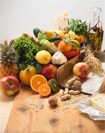 food still life - Fresh vegetables, fruit, nuts, flour, cheese and olive oil Stock Photo - Premium Royalty-Free, Code: 659-01861564