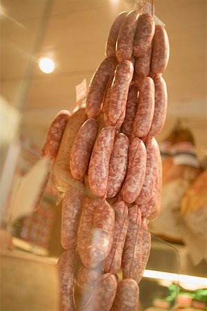 Sausages hanging up in a shop Stock Photo - Premium Royalty-Free, Code: 659-01861728