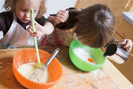 Two children baking Stock Photo - Premium Royalty-Free, Code: 659-01861764