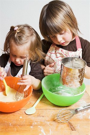 Two children baking Foto de stock - Sin royalties Premium, Código: 659-01861760