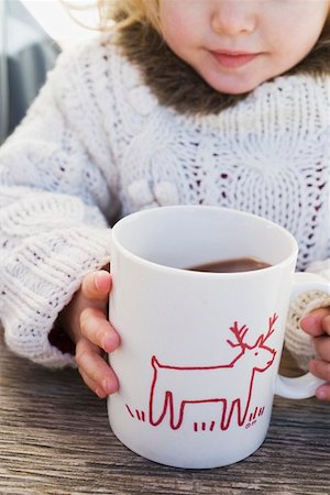 Small girl drinking large mug of cocoa Stock Photo - Premium Royalty-Free, Code: 659-01861799