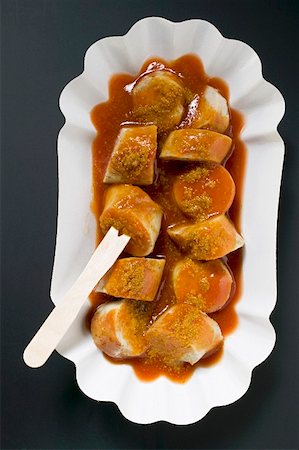 simsearch:659-01854698,k - Sausage with ketchup & curry powder in paper dish (overhead) Stock Photo - Premium Royalty-Free, Code: 659-01862127