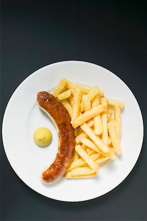 french fry top view nobody - Sausage with chips and mustard on plate Stock Photo - Premium Royalty-Free, Code: 659-01862157